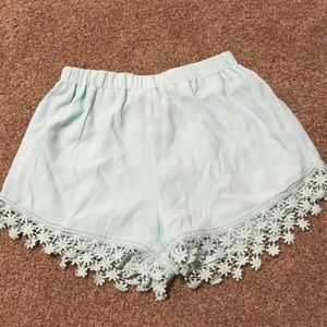 Cute Mint shorts with floral detail!